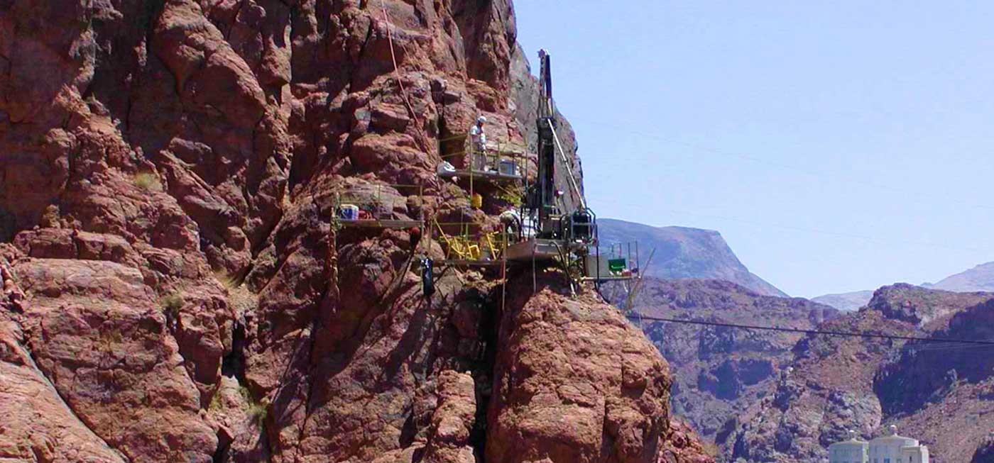 Crux Subsurface team working on a cliffside